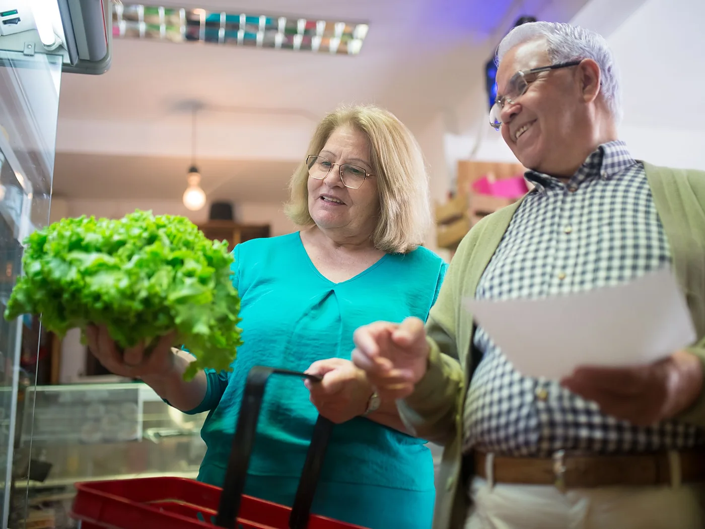 A couple choosing fresh vegetables at the market