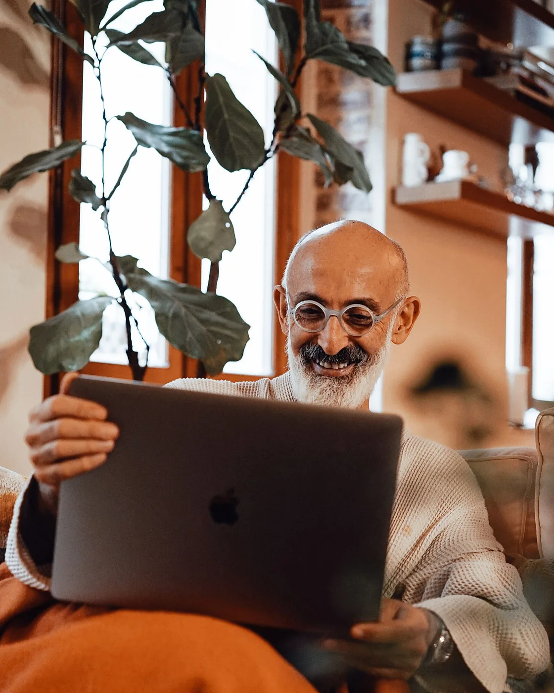 A man reading ProstaVive reviews on his laptop at home